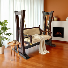 Load image into Gallery viewer, Wooden rocking chair in a room with a fireplace and plant
